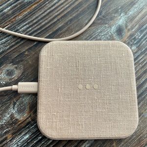 Brand new never been used.   Courant wireless charger.  Sleek and functional